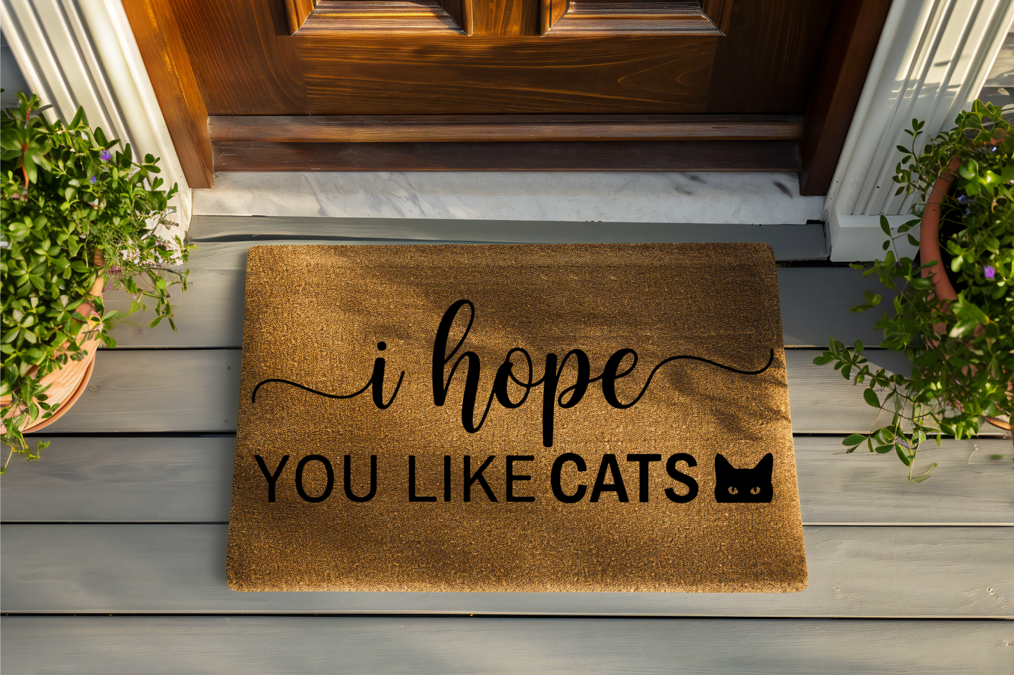 Doormat with 'i hope YOU LIKE CATS' text on a wooden floor.