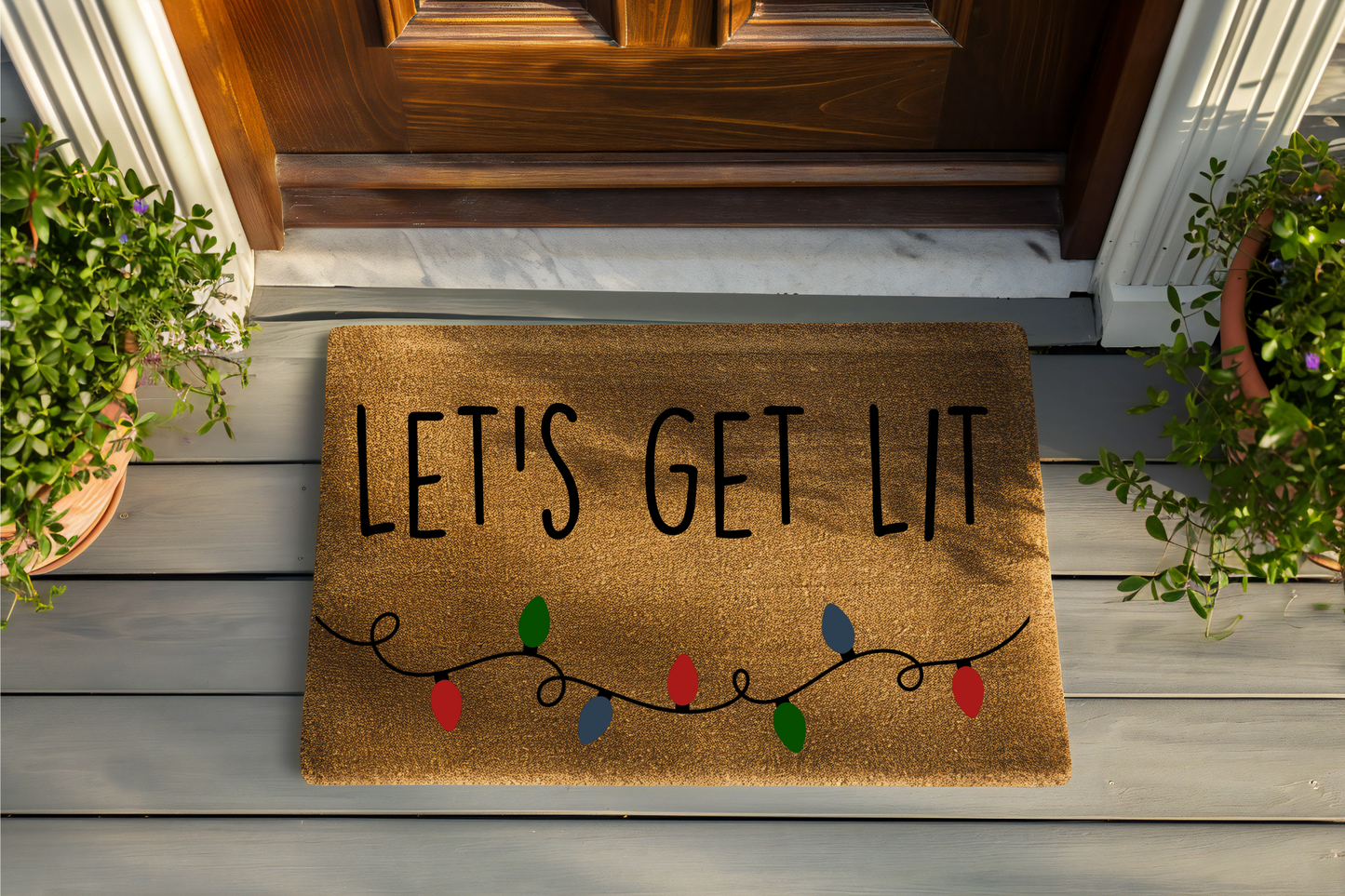 Doormat with 'LET'S GET LIT' text and Christmas lights design on a wooden floor.
