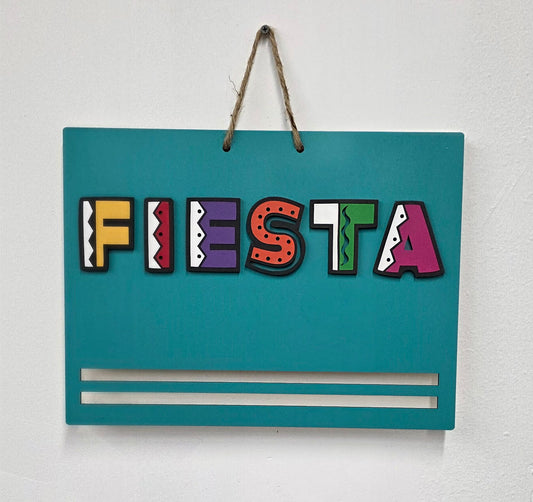 Teal Fiesta sign with colorful text on a white background