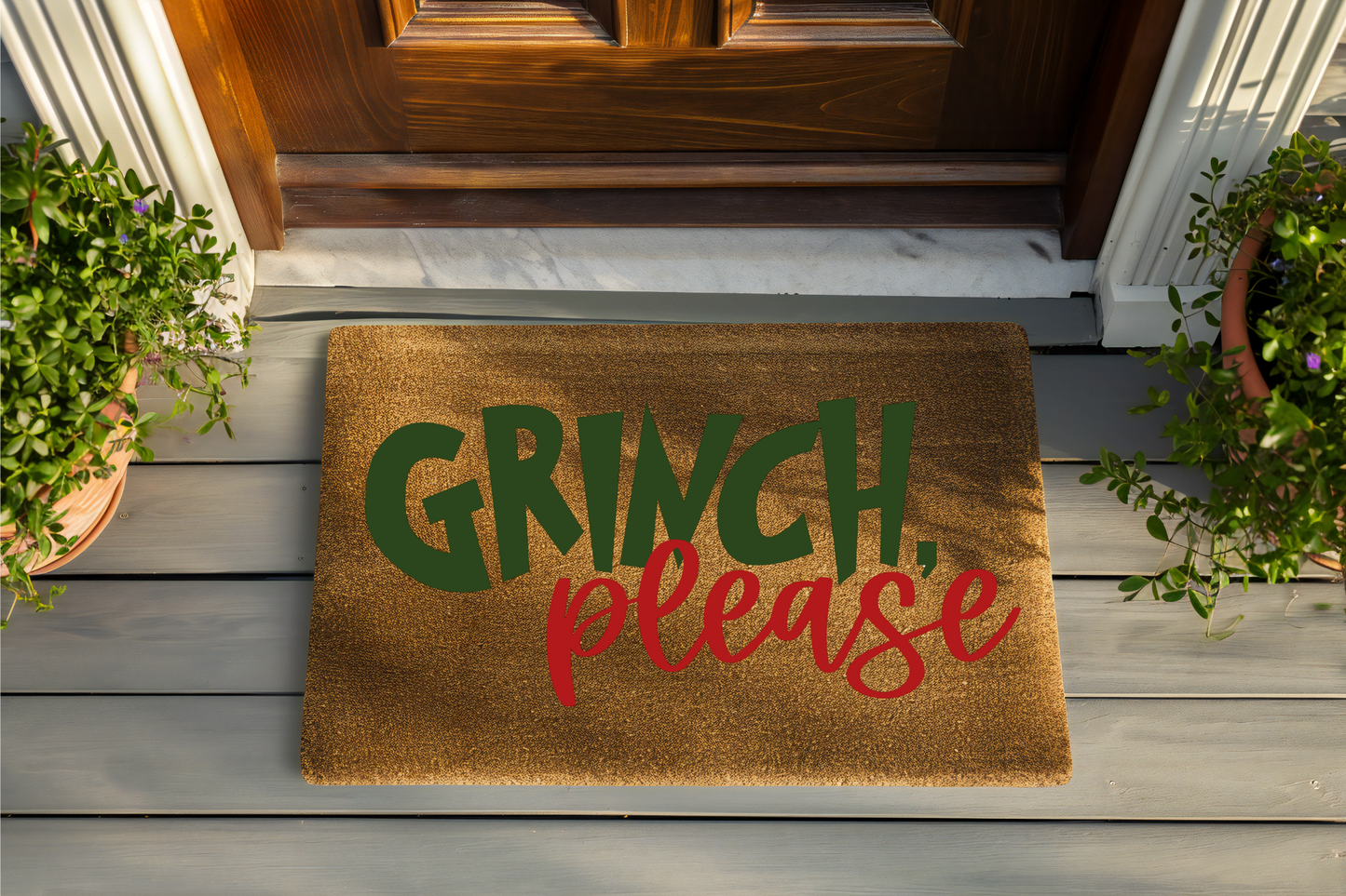 Doormat with 'Grinch, please' text on a wooden floor