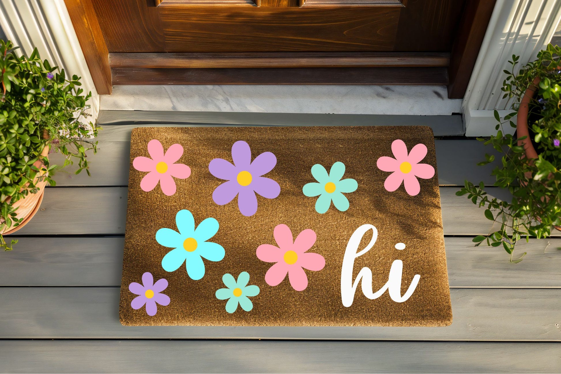 Doormat with colorful flowers and 'hi' text on a wooden floor.