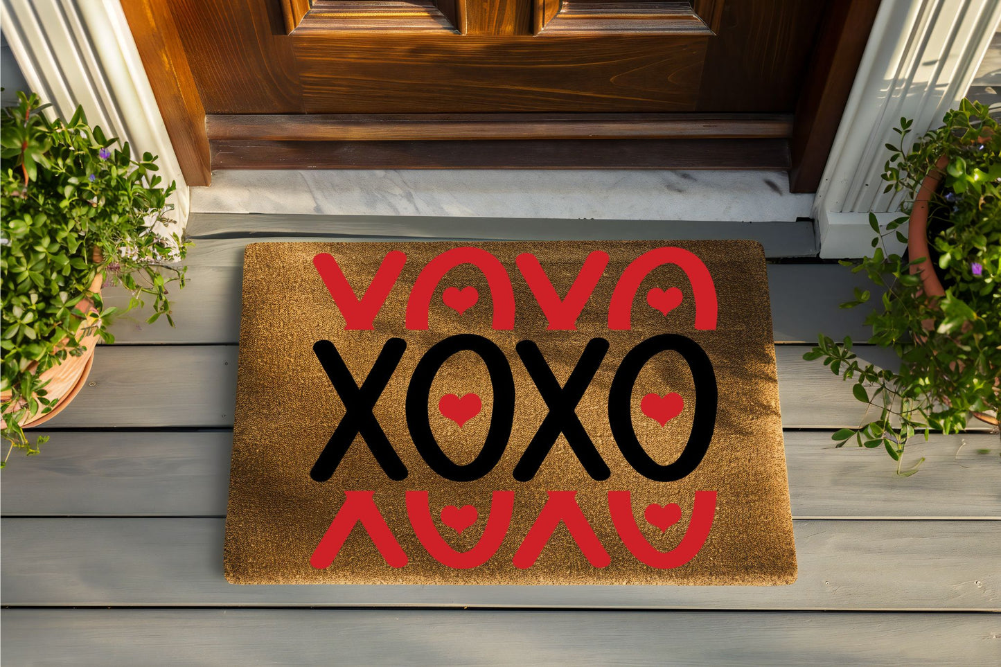 Doormat with 'Viva XOXO' text on a wooden porch
